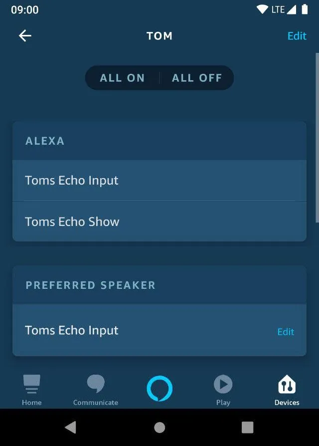 Alexa app group settings screen titled "TOM" showing two devices under the Alexa section — "Toms Echo Input" and "Toms Echo Show" — and a Preferred Speaker section with "Toms Echo Input" selected