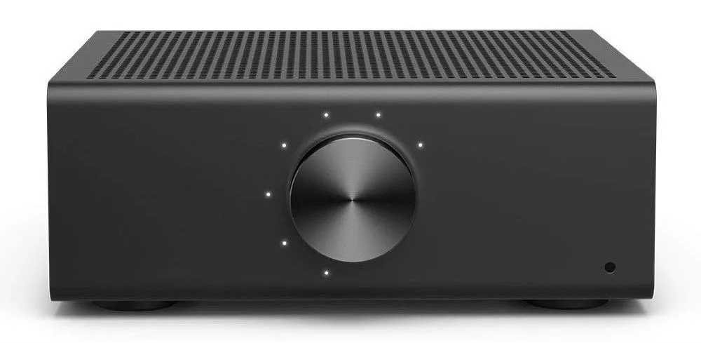 Amazon Echo Link Amp — a rectangular black amplifier with ventilation slots on top and a large round volume knob on the front face, surrounded by four small LED indicator lights